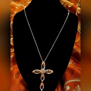This delicate, handcrafted Moldavite cross pendant is one of a kind.
